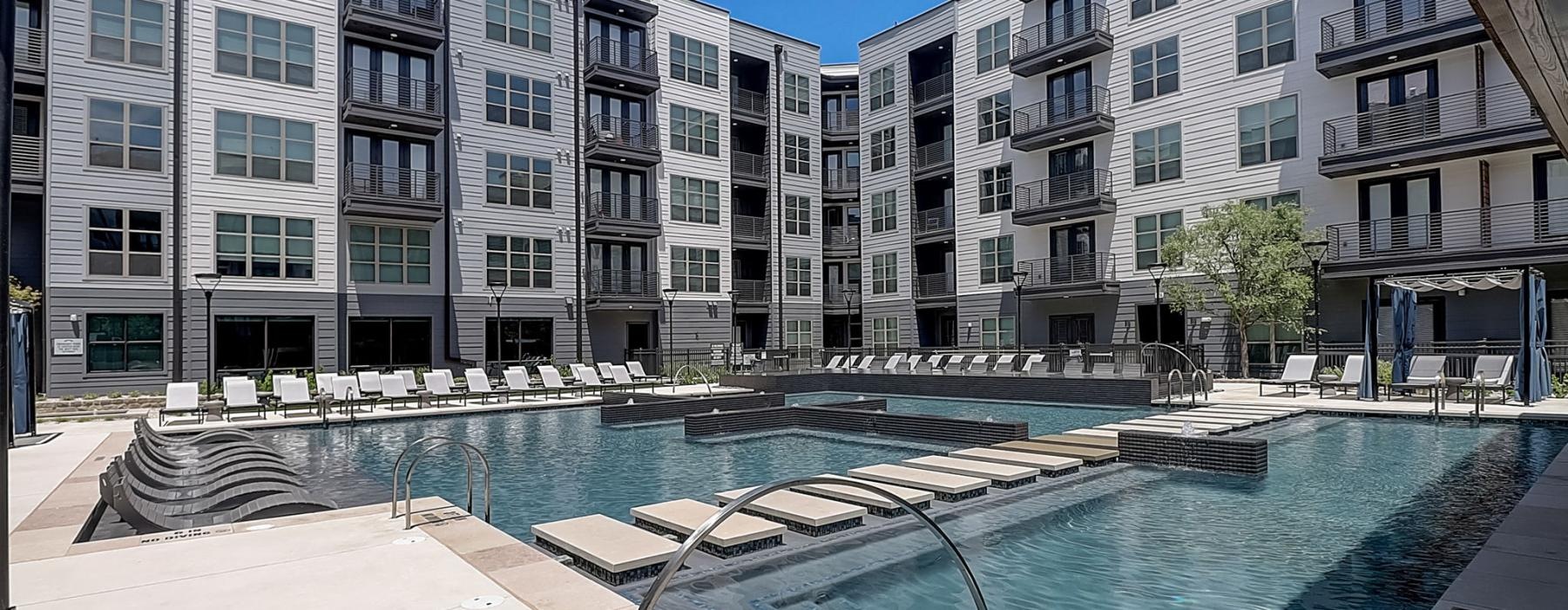 a pool in front of a building