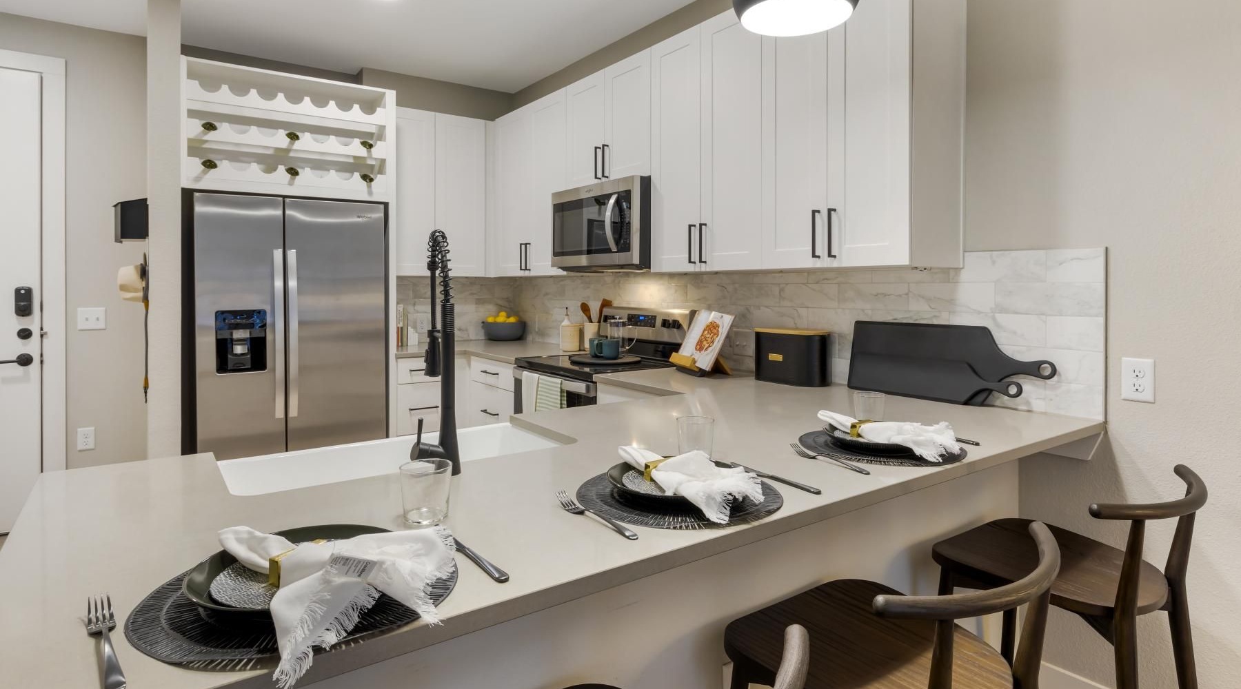 a kitchen with white cabinets