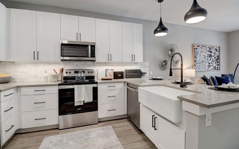 a kitchen with white cabinets